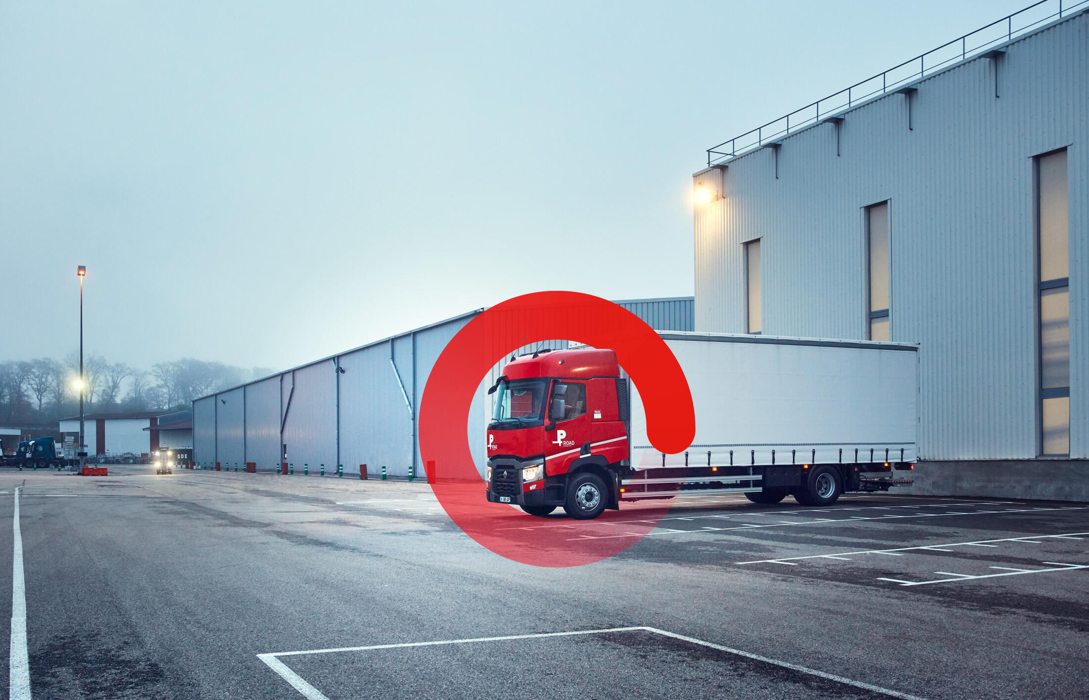 Renault Trucks Used Trucks park in front of a logistic building